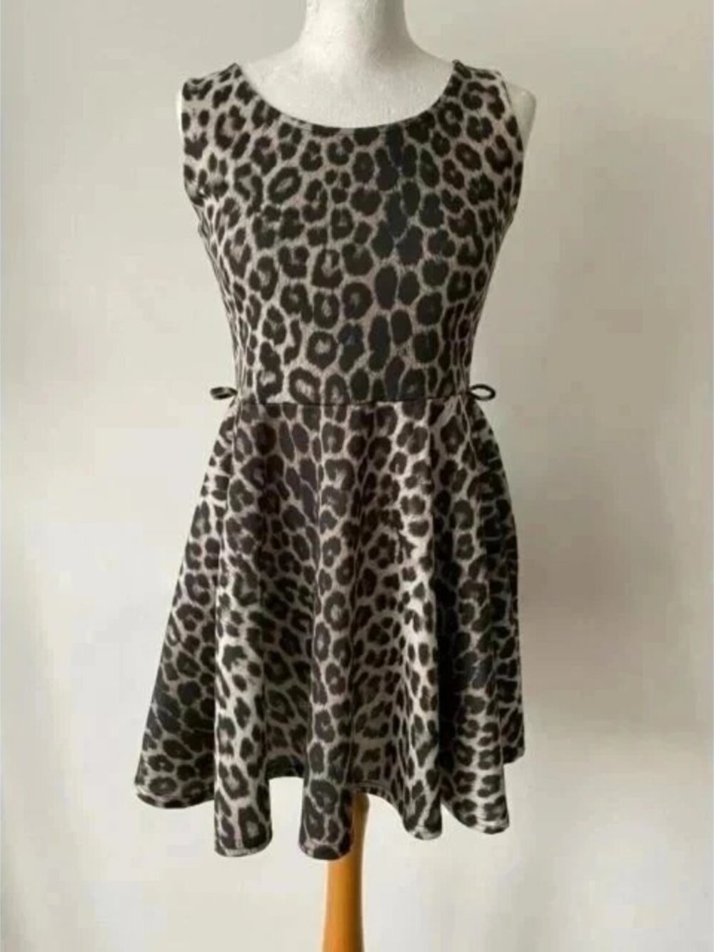 A long leather robe with a slightly wrinkled texture and a leopard print pattern